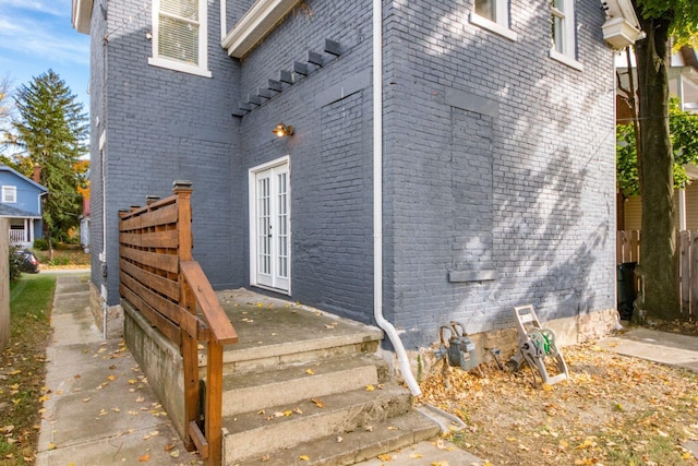 view of side of home with french doors