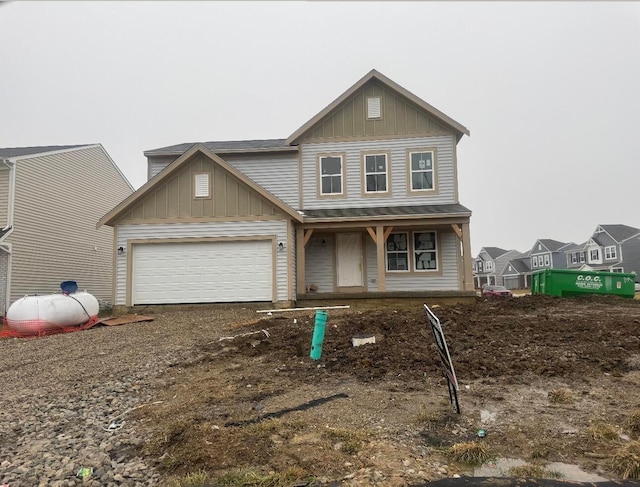 view of front facade featuring a garage and covered porch