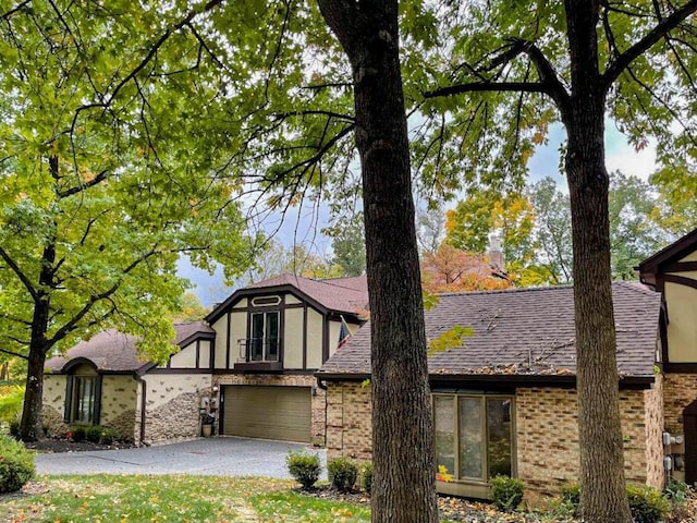 tudor-style house with a garage