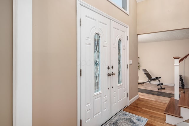 entryway with light hardwood / wood-style floors