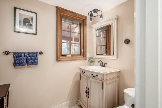 bathroom featuring vanity and toilet