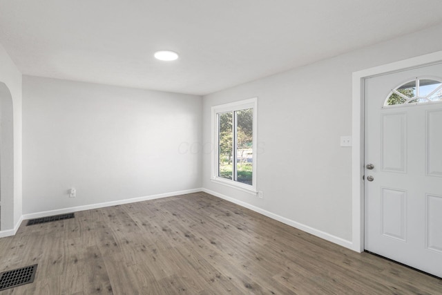 1961 Dartmouth Ave, Columbus, OH 43219 - foyer entrance with arched walkways and wood finished floors