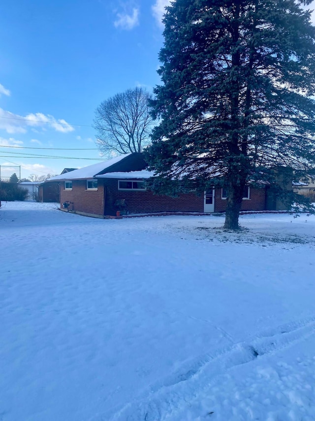 view of yard covered in snow