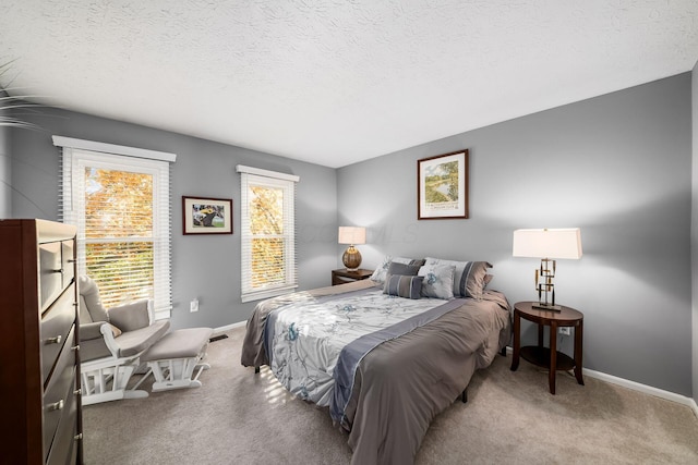 carpeted bedroom with a textured ceiling