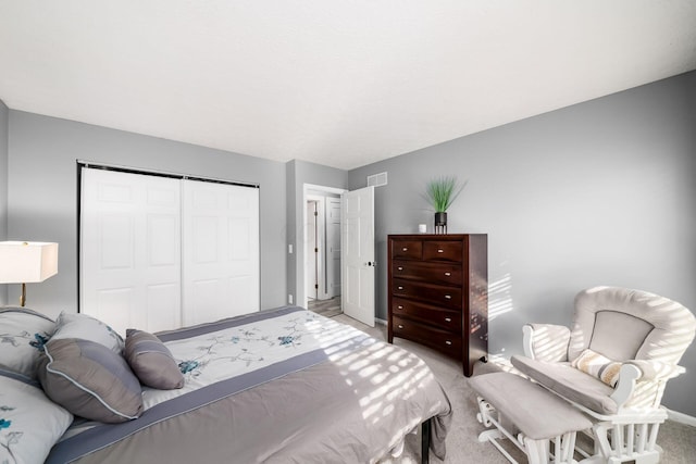 carpeted bedroom featuring a closet