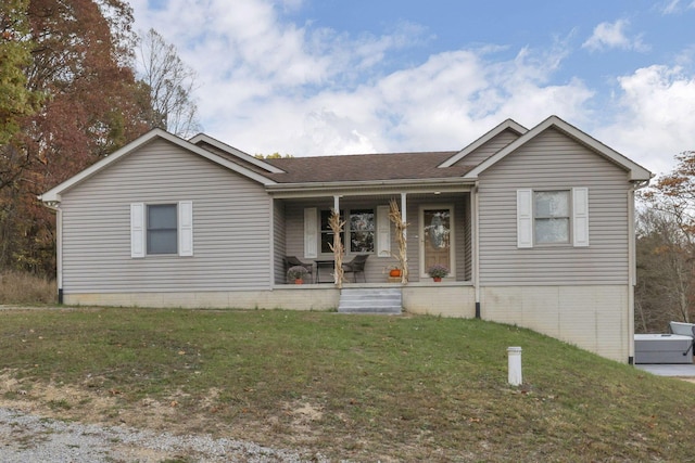 view of front facade with a front lawn and a porch