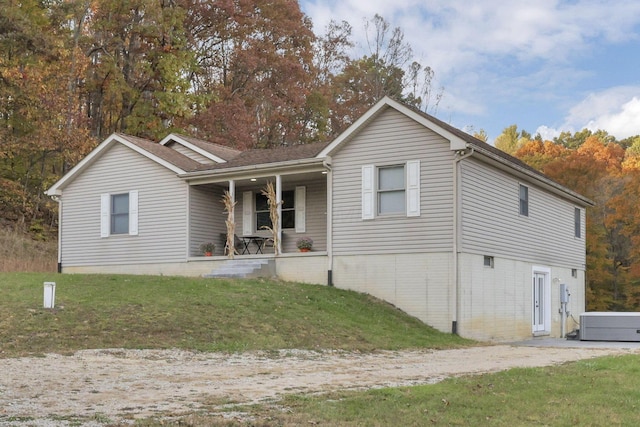 view of front of home with a front lawn and covered porch