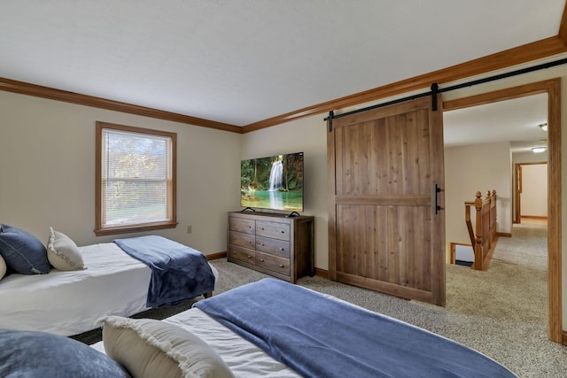 carpeted bedroom featuring a baseboard heating unit, a barn door, and crown molding