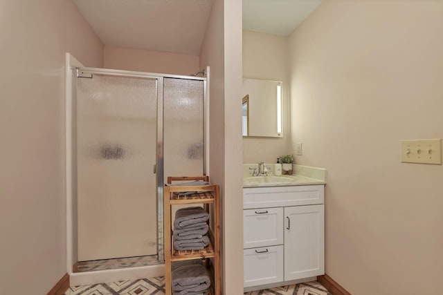 bathroom featuring vanity and an enclosed shower