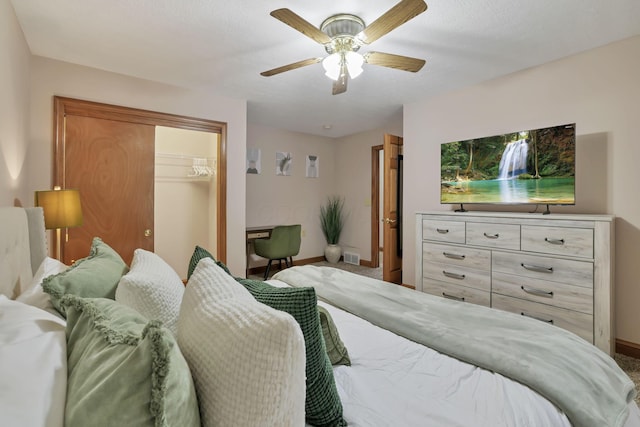 carpeted bedroom with a closet and ceiling fan