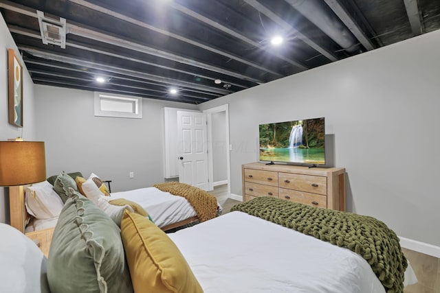 bedroom featuring wood-type flooring