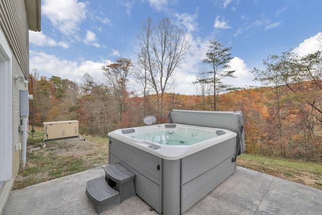 view of patio / terrace with a hot tub