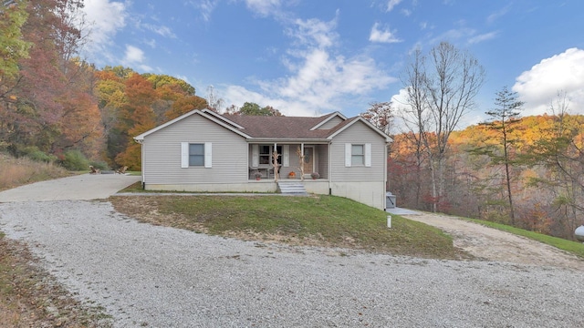 view of front facade with covered porch and a front lawn