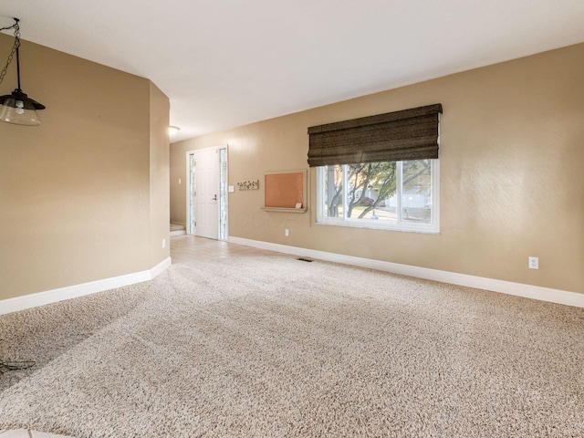 empty room with carpet flooring