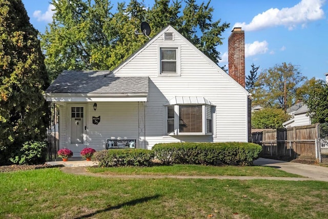 view of front of property with a front yard and a porch