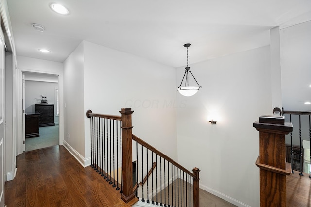 corridor with dark wood-type flooring