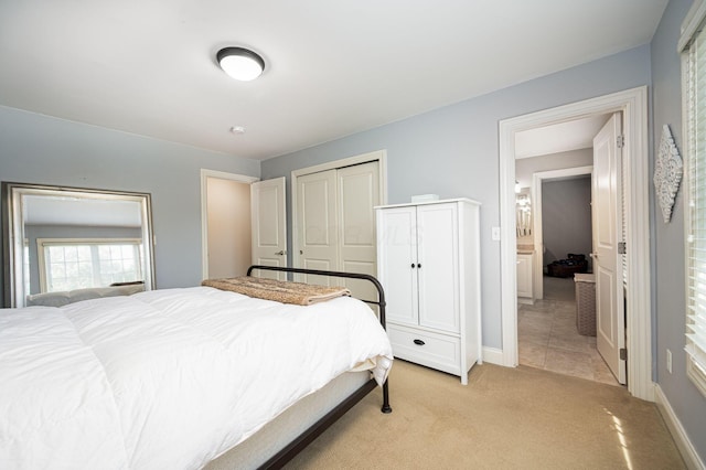 carpeted bedroom with a closet