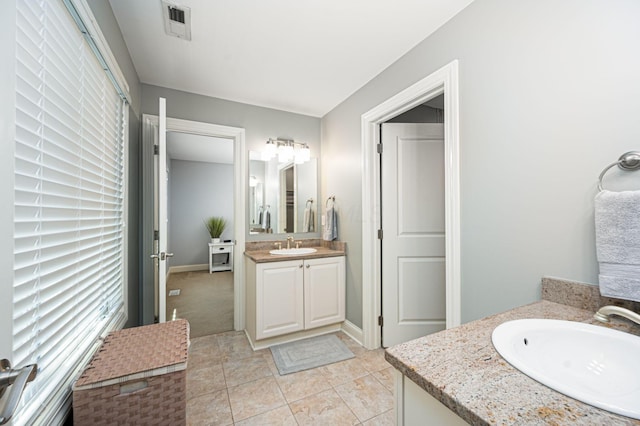 bathroom with tile patterned flooring and vanity