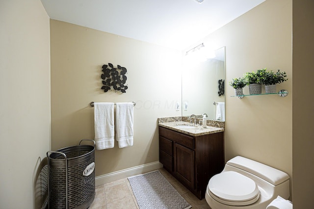 bathroom with tile patterned floors, vanity, and toilet