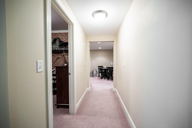 hallway with light colored carpet