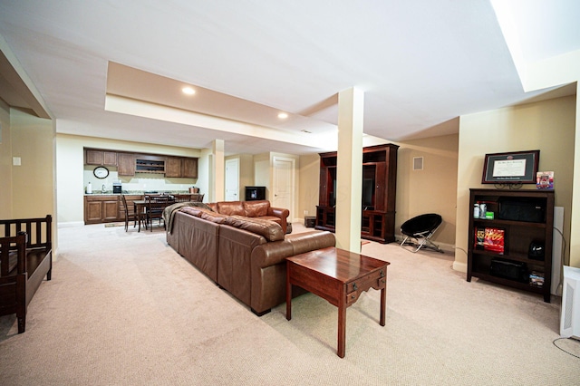 living room featuring light carpet