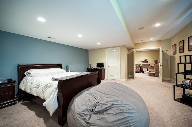 bedroom with light colored carpet