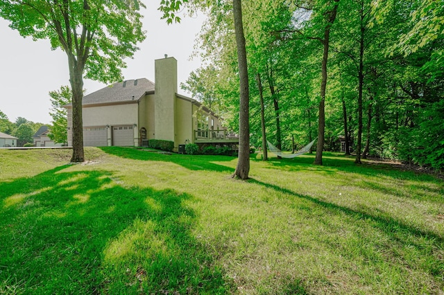 view of yard with a garage