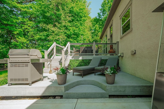 view of patio / terrace featuring a grill and a wooden deck