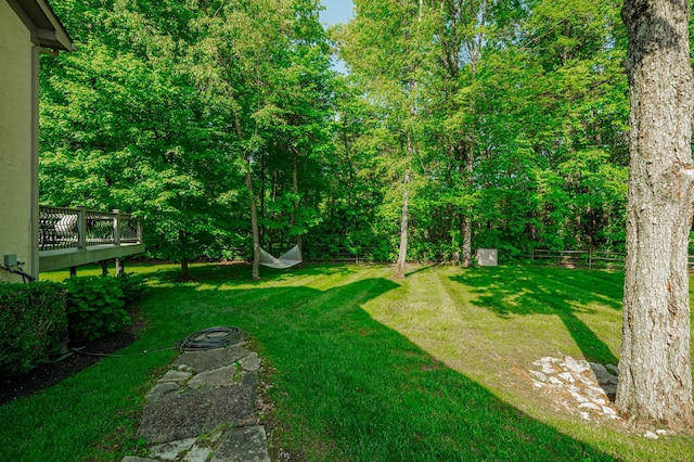 view of yard with a wooden deck