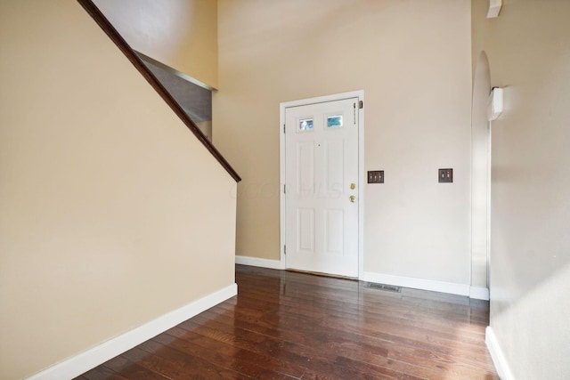 entrance foyer featuring dark hardwood / wood-style floors