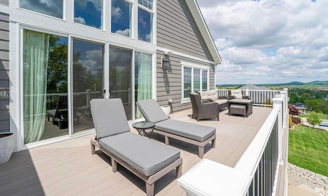 wooden deck with outdoor lounge area