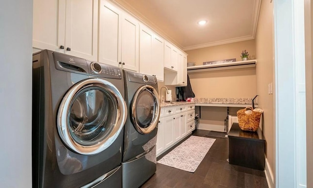 laundry area with cabinets, dark hardwood / wood-style flooring, washer and dryer, and ornamental molding