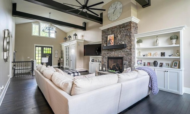 living room featuring a fireplace, french doors, dark wood-type flooring, and beam ceiling