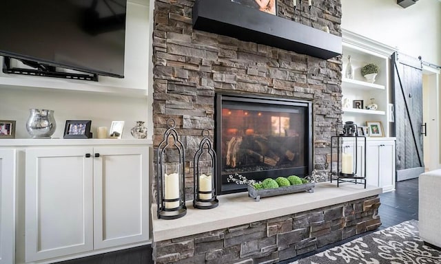 interior details featuring wood-type flooring and a fireplace