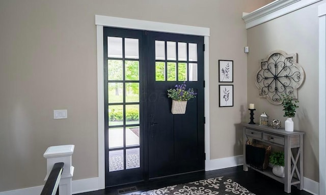 entrance foyer featuring dark hardwood / wood-style floors