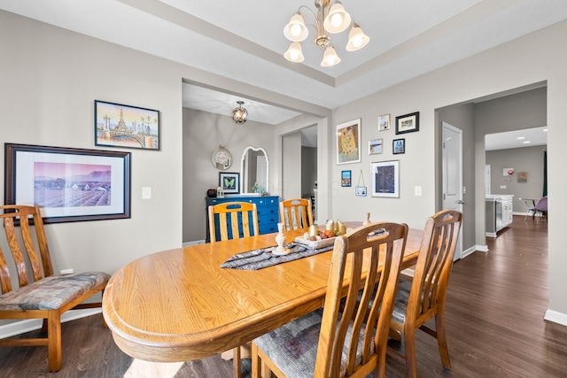 dining space with a chandelier and dark wood-type flooring