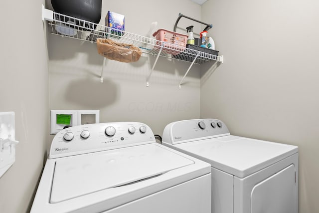 laundry room with washer and dryer