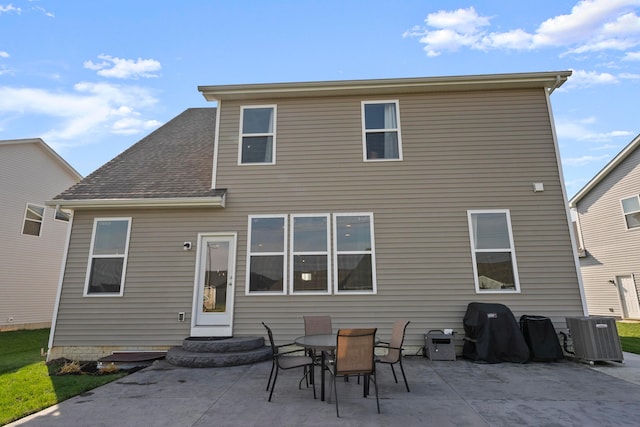 back of house featuring a patio area and central AC unit