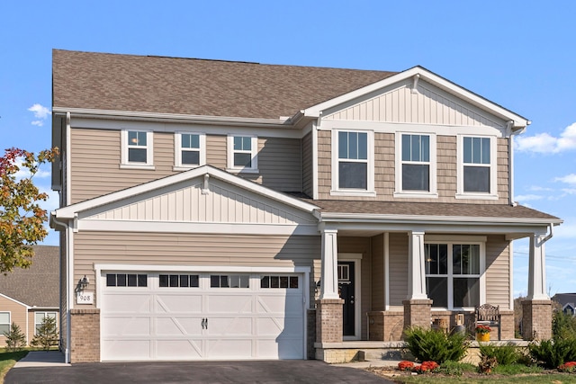 craftsman-style home featuring a porch and a garage