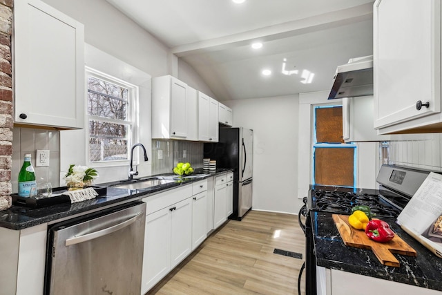 kitchen with black gas range, white cabinets, sink, vaulted ceiling, and stainless steel dishwasher