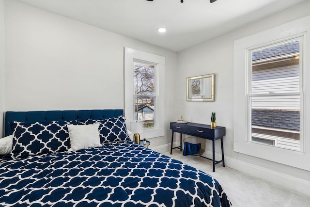 carpeted bedroom featuring ceiling fan