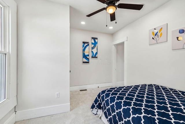 carpeted bedroom with ceiling fan