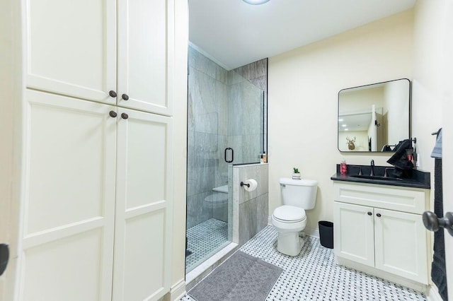 bathroom with vanity, toilet, and walk in shower