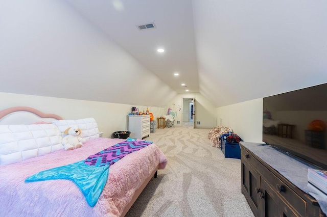 bedroom featuring light colored carpet and vaulted ceiling