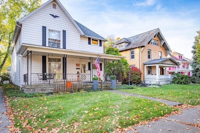 view of front of home featuring a front lawn and covered porch