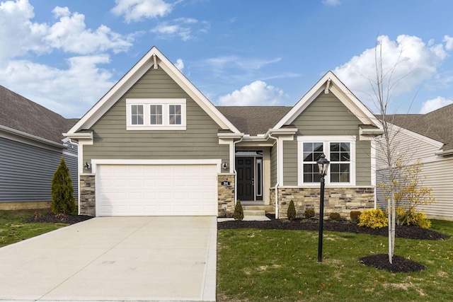 craftsman-style home with a garage and a front yard