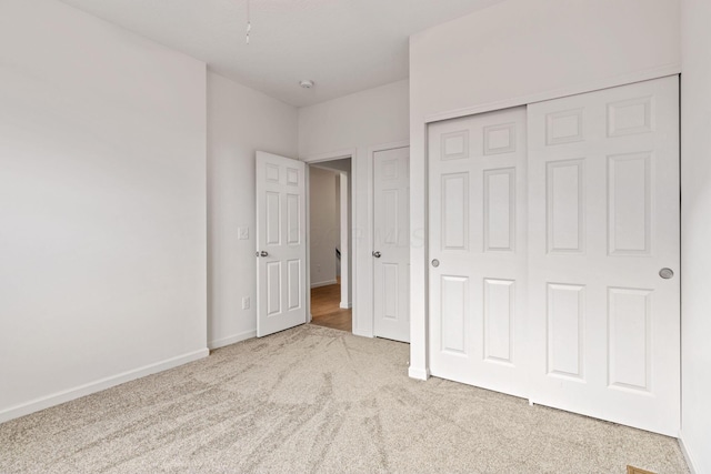 unfurnished bedroom featuring a closet and carpet