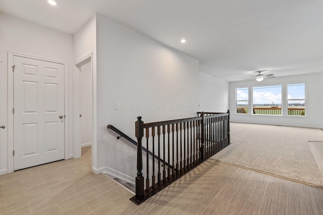 corridor with light colored carpet