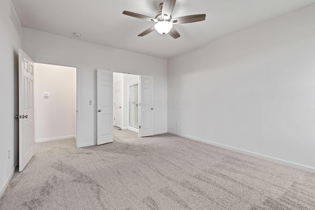 unfurnished bedroom featuring ceiling fan and light colored carpet