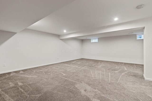 basement with carpet flooring and plenty of natural light